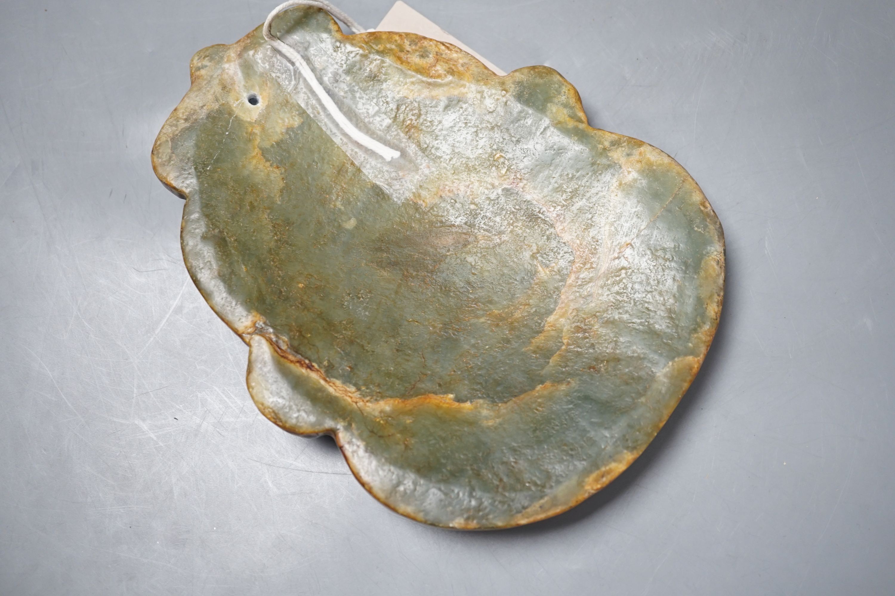 A green hard stone mask carving, height 21cms